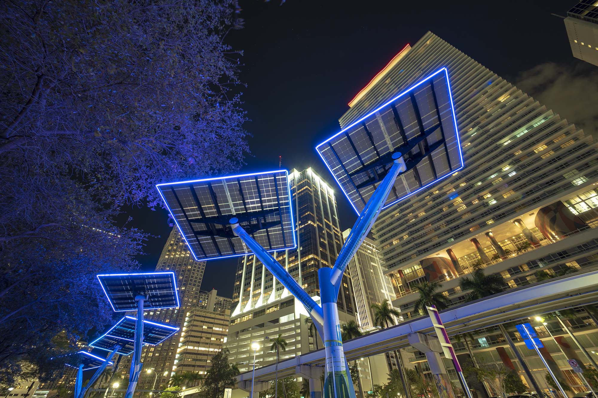 Rows of solar panels under bright sky