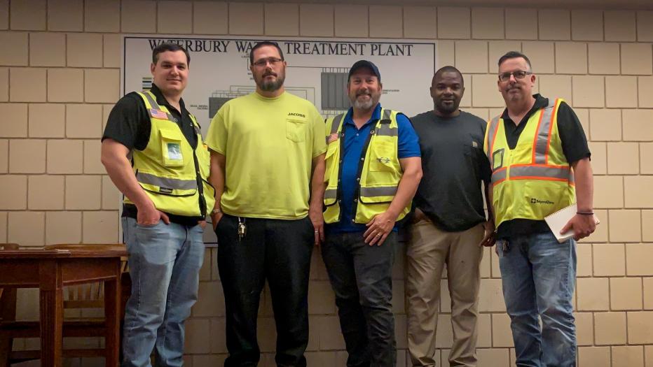 Team of engineers in their yellow PPE