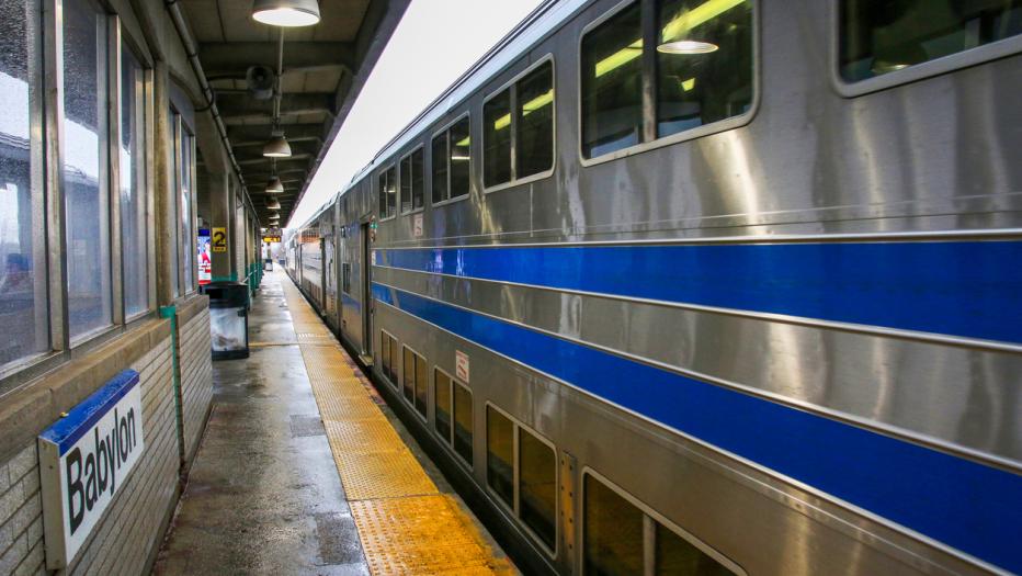 A long Island Railroad Train is arriving from the east at the Babylon Station.