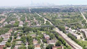 Aerial view of Chicago neighborhood and roadway with downtown in horizon