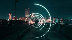 Stock image an electric swirl on a bridge with a cityscape in the background