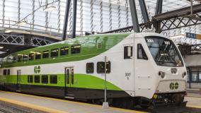 Green and white Hydrail train parked