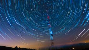 time lapse image of stars moving around sky