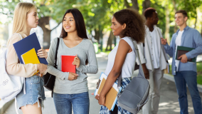 women students talking on campus