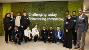 Students pose at the London Cottons Centre Office with Bob Pragada and Brian Cox