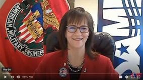 Heather Wishart-Smith with SAME flag in background