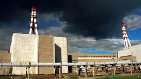 Power plant under dark skies