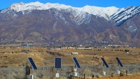 Solar panels in front of mountains