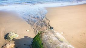 Water spilling onto beach