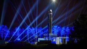 Orbex Prime rocket at night with blue lights
