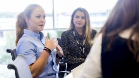 Three women engaged in conversation