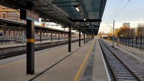 View of platform and rail track at station.