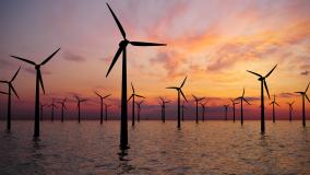Offshore Wind Turbines Farm At sunset