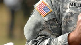 the American flag attached to the American military uniform.