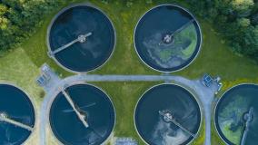 Aerial view of a city's waste management sewage and water treatment plants. Waste water purification.