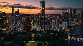 vibrant cityscape of Brisbane at dusk, viewed from an elevated perspective