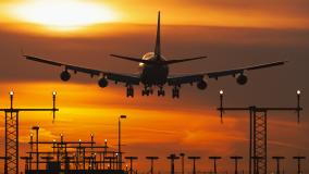 Plane in the sunset sky