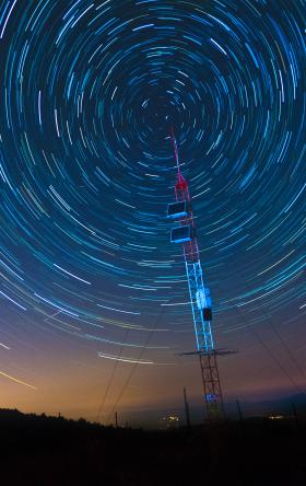 time lapse image of stars moving around sky