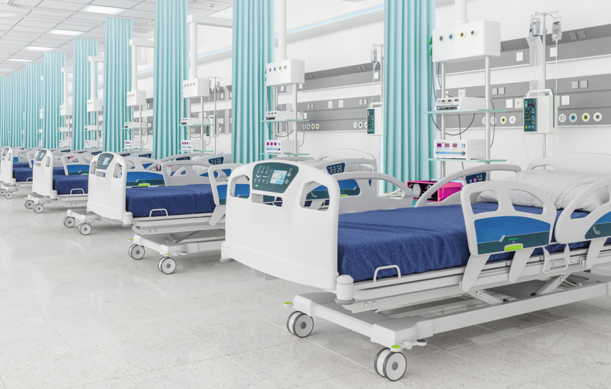 Stock image of blue hospital beds lined up