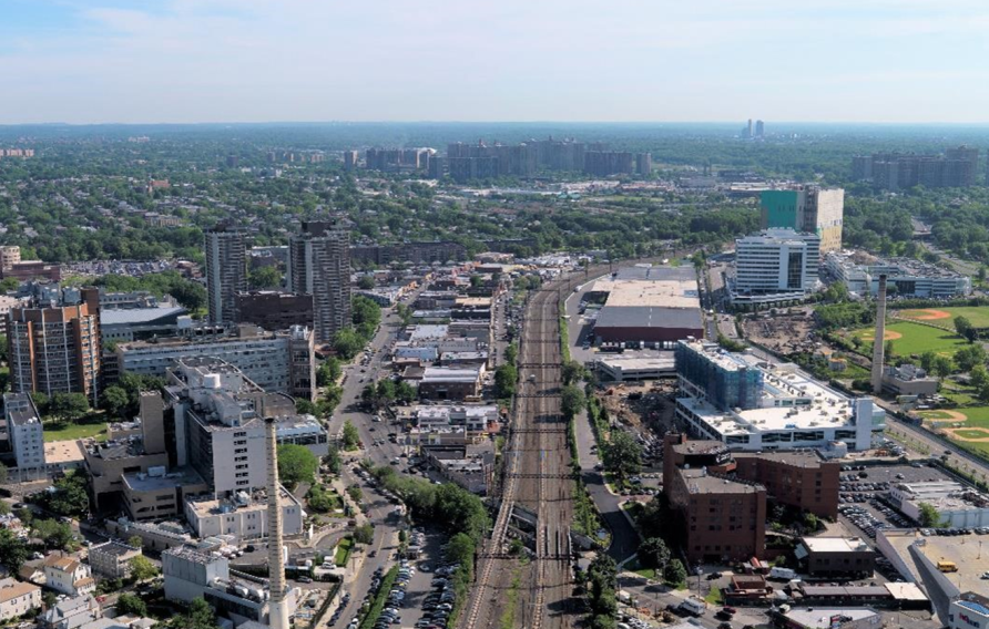 Train tracks through a cityscape