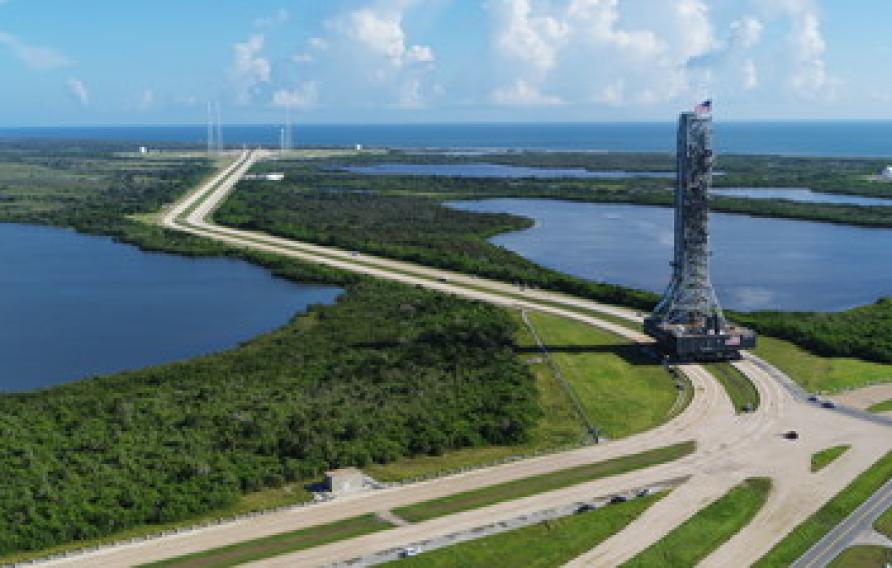 Mobile launch on crawler on runway at Kennedy Space Center