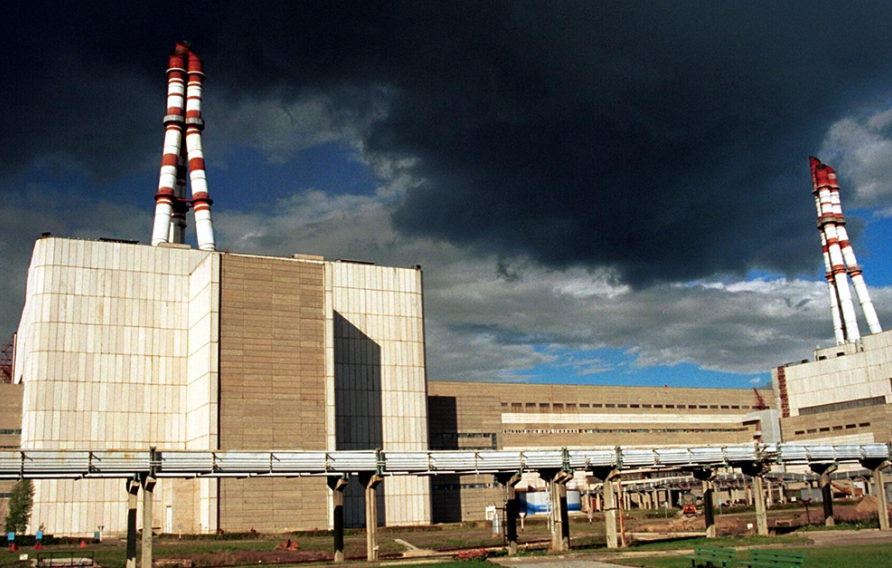 Power plant under dark skies