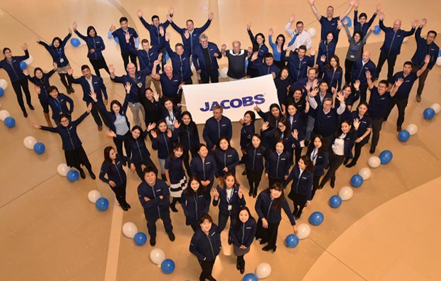 Jacobs employees standing in shape of heart