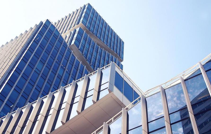 Stock image of skyscrapers with glass windows top to bottom