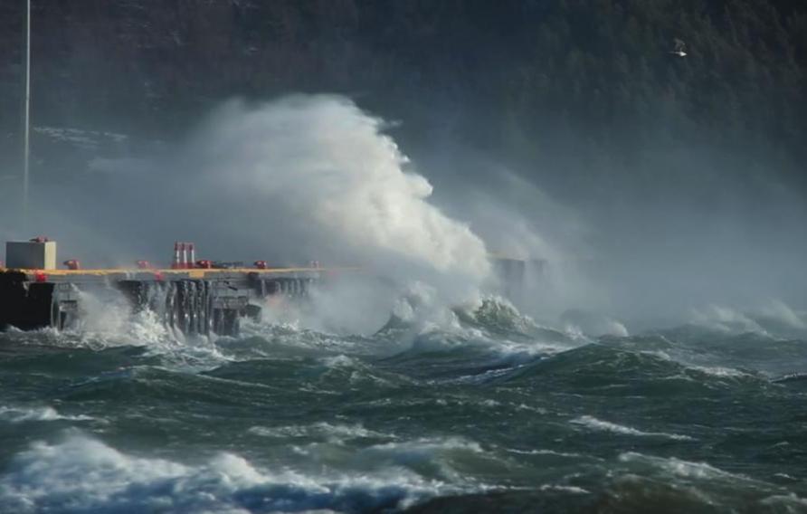 Stock image of water washing up on infrastructure