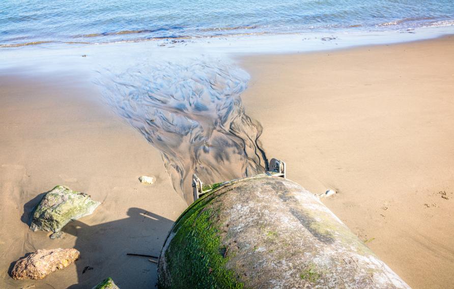 Water spilling onto beach