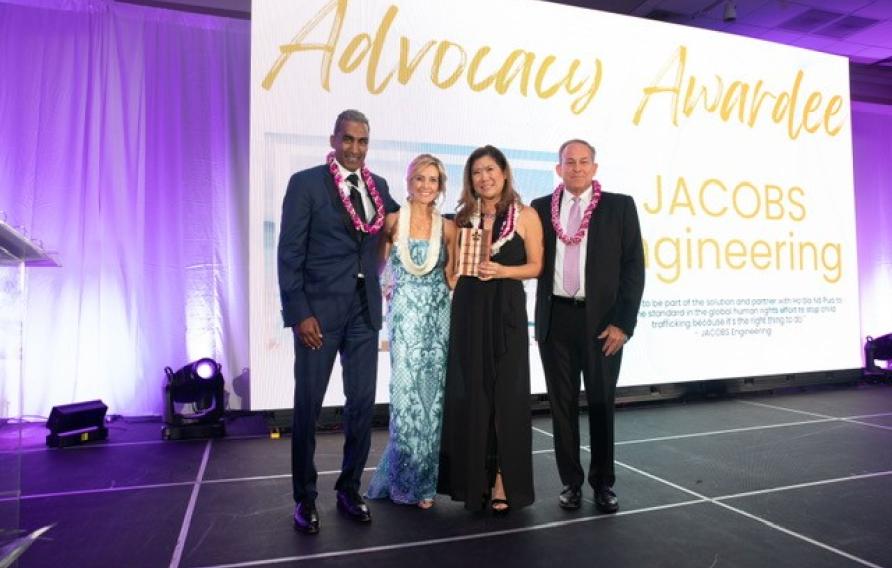 Bob Pragada, Tim Byers and Julie Hong accepting the 2022 Advocacy Award on behalf of Jacobs.