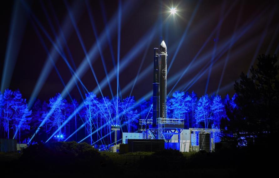 Orbex Prime rocket at night with blue lights