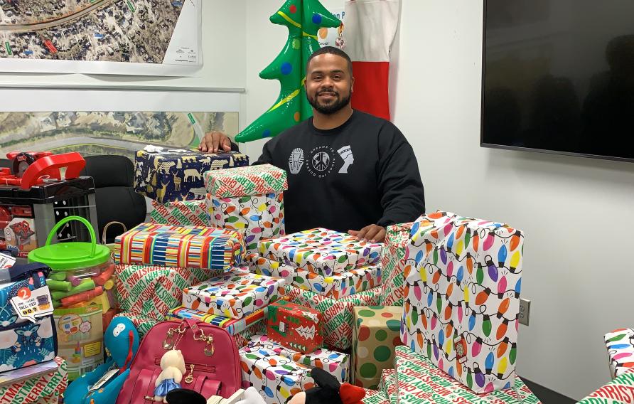 Tracy Stephens with gifts for Dreams to Kings and Queens