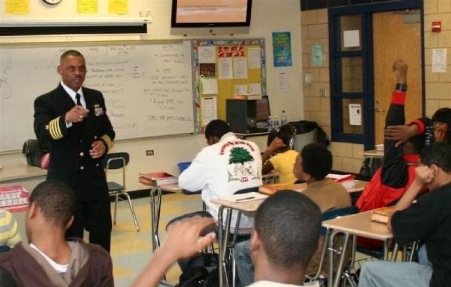 Jake Washington visiting a high school in Chicago