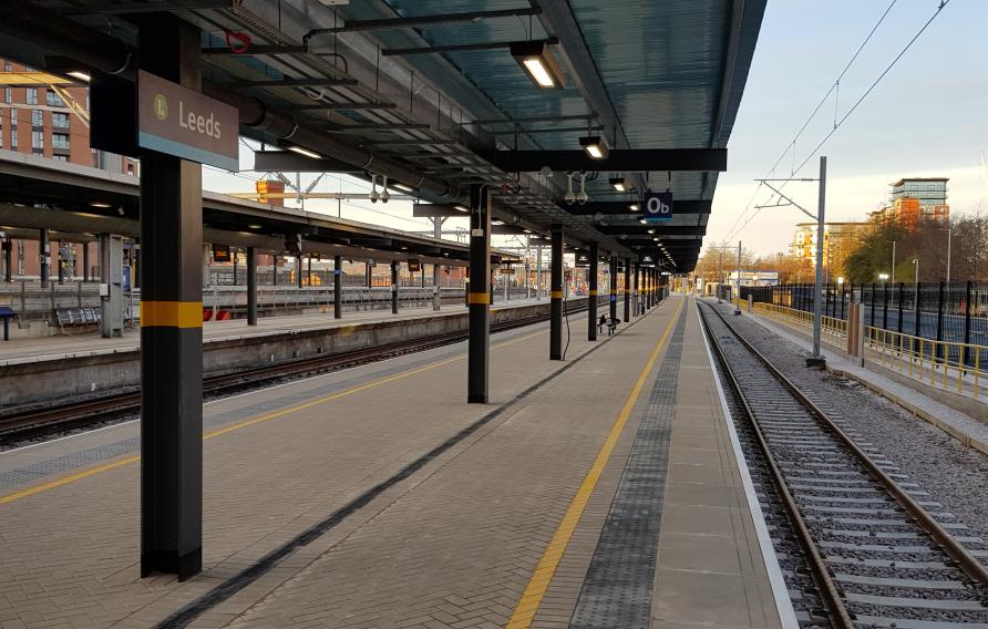 View of platform and rail track at station.