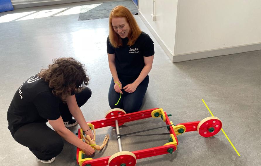 Rachael Cassidy works with a young student on a STEAM activity