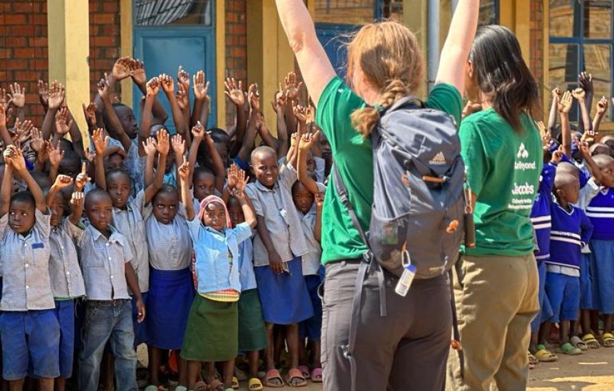 Cheering with local school children