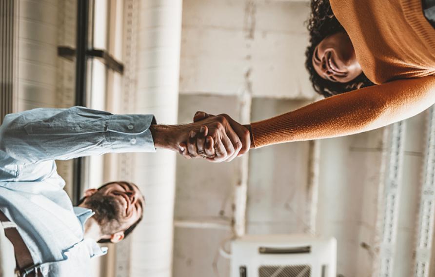 Male and female shaking hands