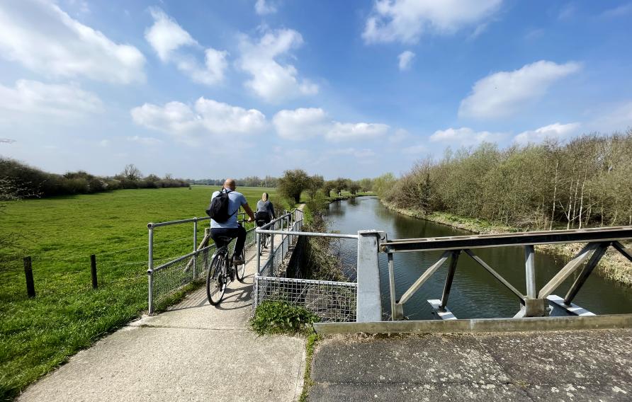 Two cyclist o a tow path along the River Stort in Hertfordshire. May 2023