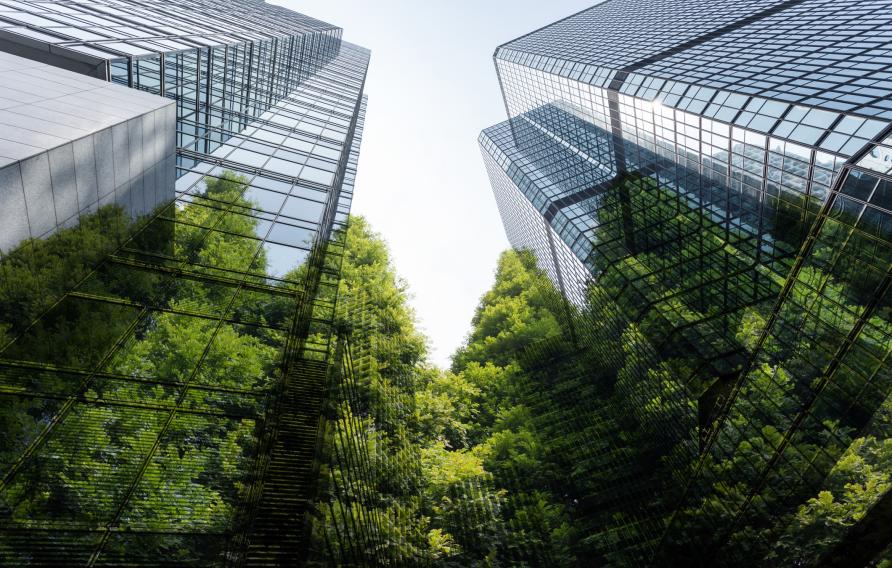 Looking up at a building with trees in the background