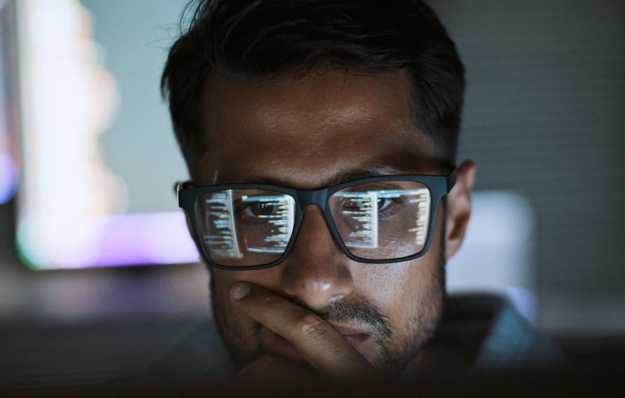 Man looking at a computer