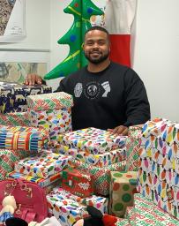Tracy Stephens with gifts for Dreams to Kings and Queens