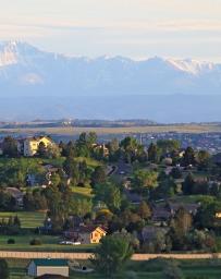 Landscape view of Centennial, Colorado neighborhood with the Rocky Mountains in the background