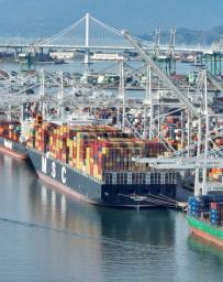 Vessels and cranes at the Port of Oakland container terminal in Oakland, California.
