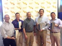 Men posing with awards
