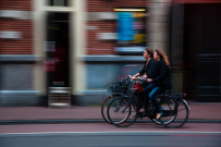 Two people riding bikes