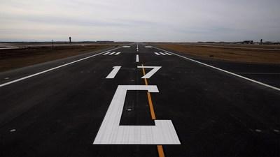 Airport runway in overcast skies