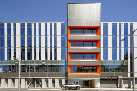 External view of the main entrance to the new hospital building on a sunny day