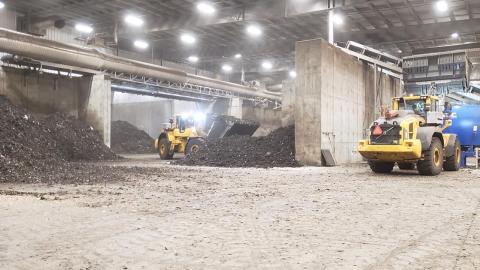 Trucks move compost at the Calgary Composting Facility