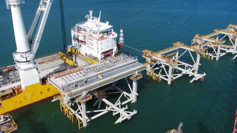 Wharf under construction with with modules in place and decking being layed